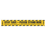 COVID-19 Social Distancing Floor Graphic, Yellow and Black Tape with Instructions to Stay Safe and Stand Here to Prevent the Spread of Covid-19.