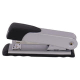 Medium-Sized Silver Stapler with Black Handle and Base, from Brand 67, Capable of Stapling 20 Pages, Made of Durable Steel, with a Sleek and Compact Design, Described as a Reliable Silver Stapler for Office and Home Use.