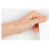Flipchart Paper Bond 30 Sheets, Person Peeling off a Sheet of 860 x 610 mm White Flipchart Paper.