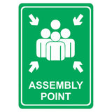Green Assembly Point Sign with White Graphic and Text, Printed on White ACP Using UV Print Technology, 297 x 210 mm, Featuring Rounded Edges and Double-sided Tape, from Brand 67, in A4 Size.