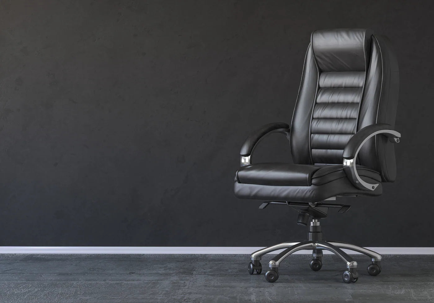 Black high-back executive office chair on a charcoal studio background